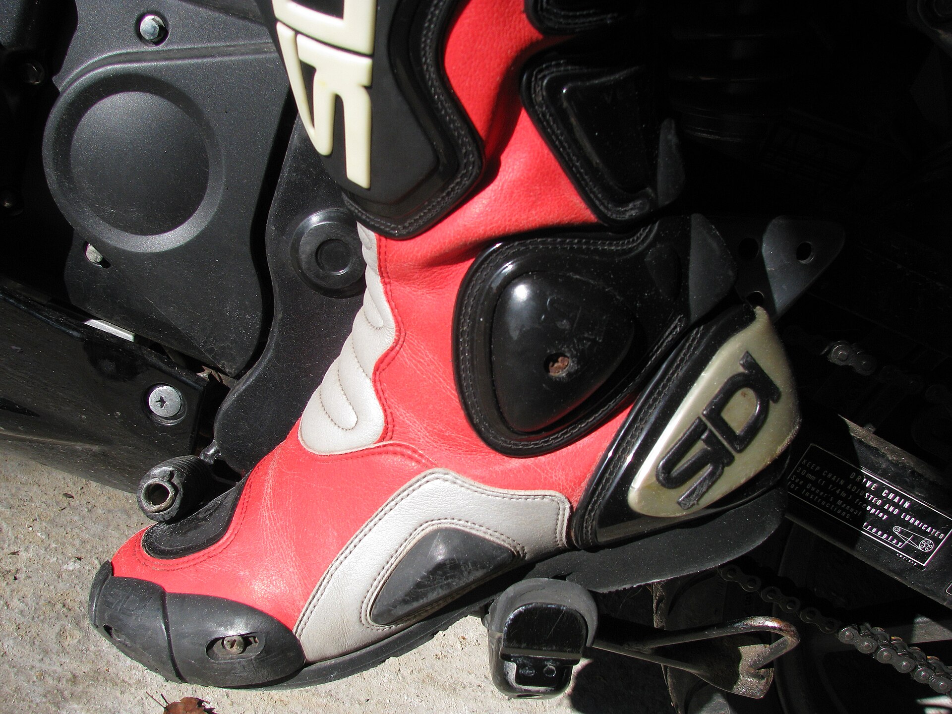 Racing boot heel and ankle structure